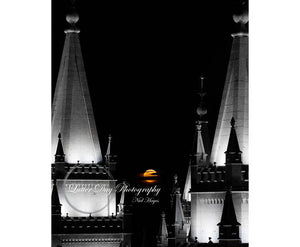 A rare image of the moon setting between the spires of the Salt Lake City Temple at dawn.